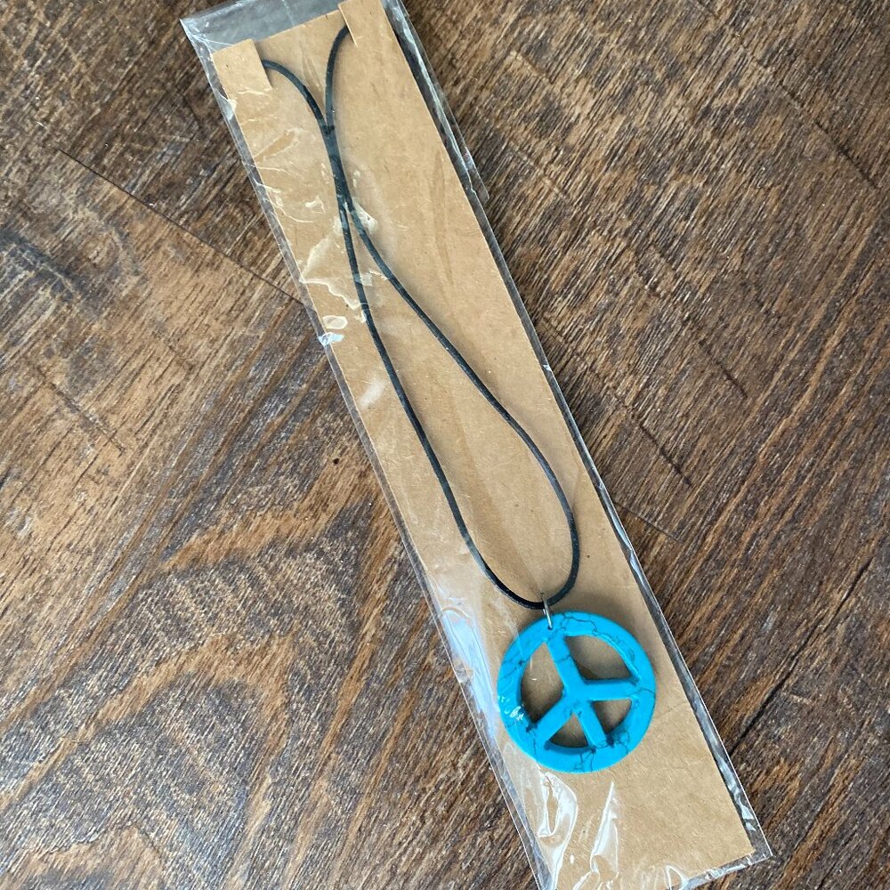 For sale simulating dyed howlite turquoise stone  peace sign black cord necklace